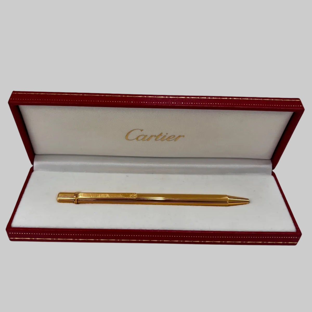 CARTIER Penna a sfera corpo in metallo oro motivo striato