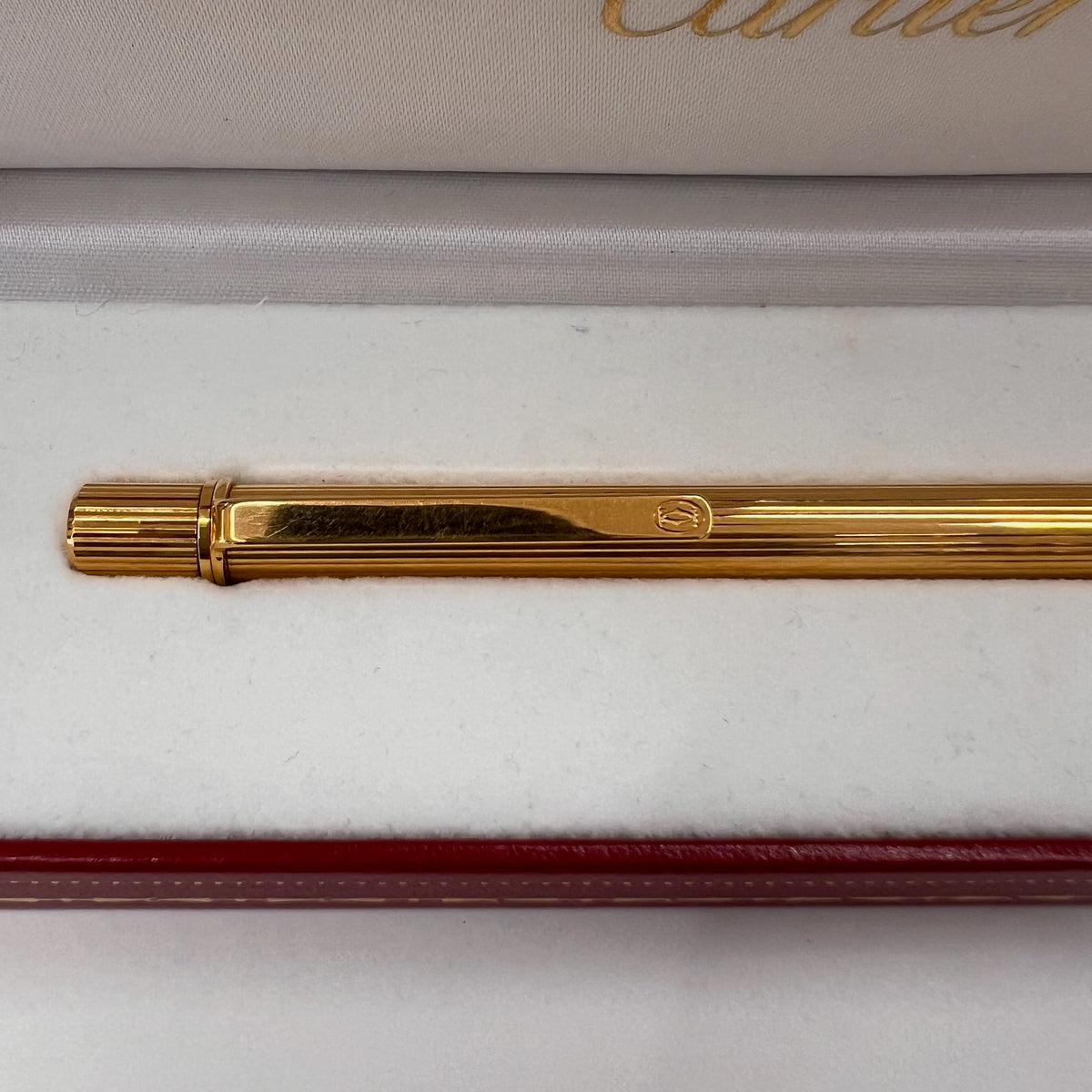 CARTIER Penna a sfera corpo in metallo oro motivo striato