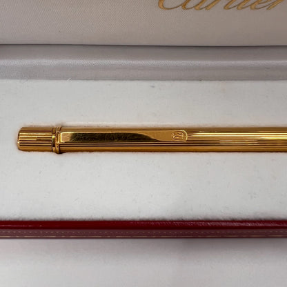CARTIER Penna a sfera corpo in metallo oro motivo striato