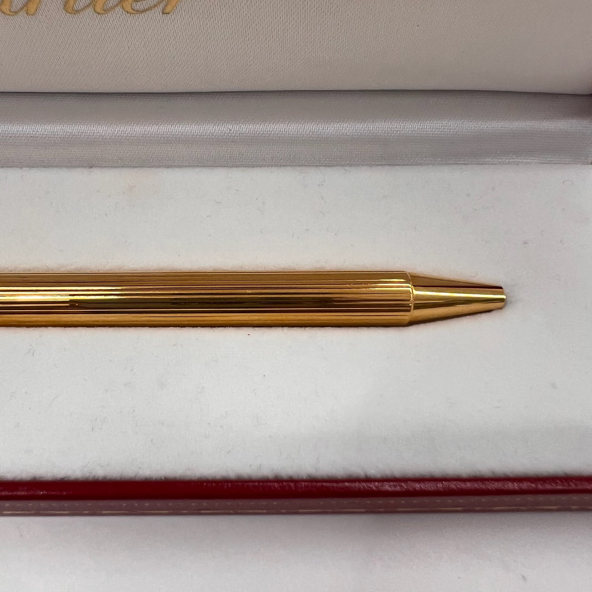 CARTIER Penna a sfera corpo in metallo oro motivo striato