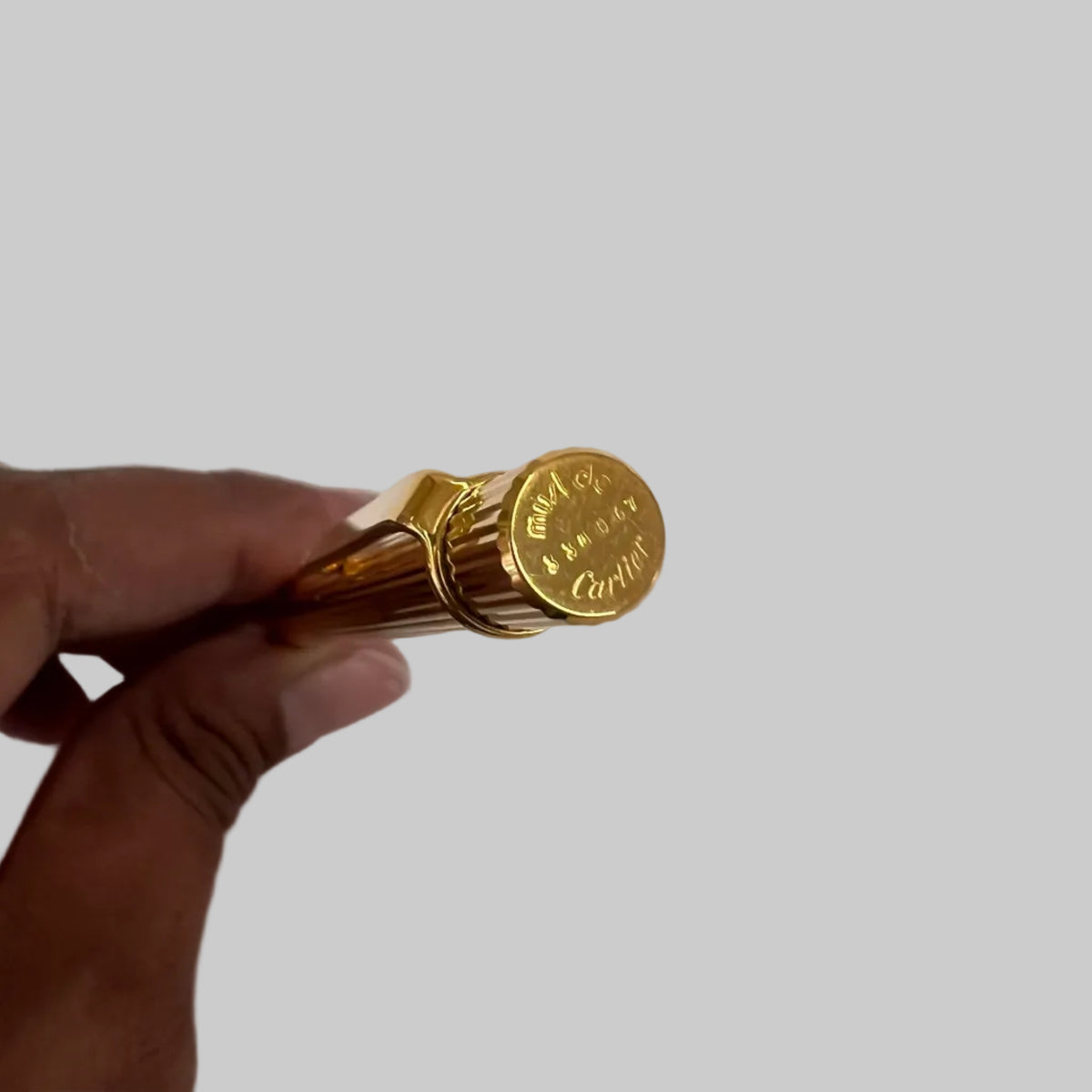 CARTIER Penna a sfera corpo in metallo oro motivo striato