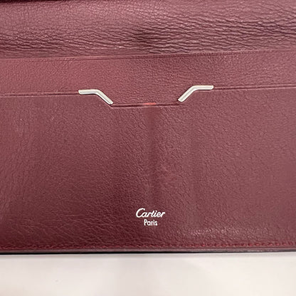 CARTIER Portadocumenti "Must de Cartier" pelle nera ed interno bordeaux 