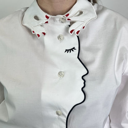 VIVETTA Camicia bianca con ricamo mani e profilo viso di donna