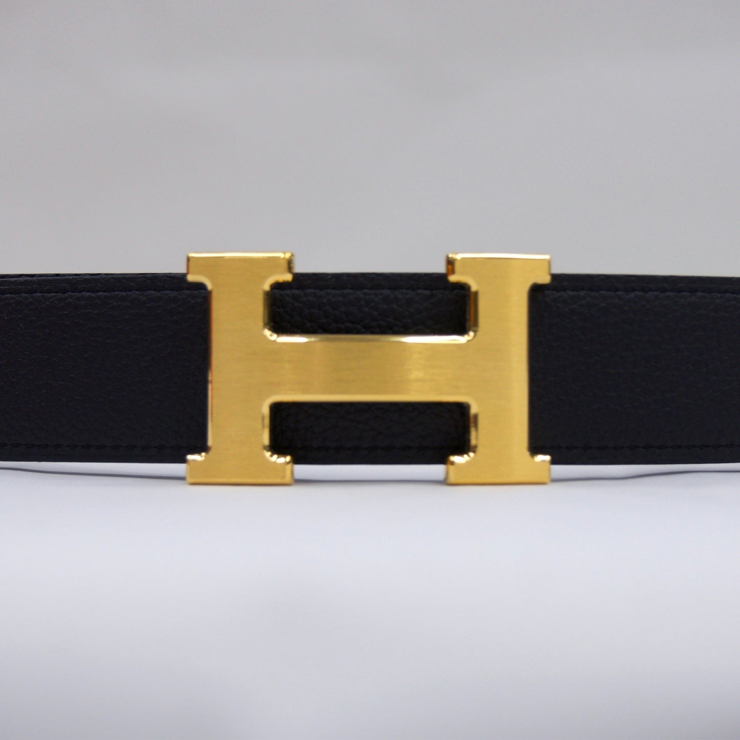 HERMES Cintura blu notte reversibile marrone con fibbia H oro satinato