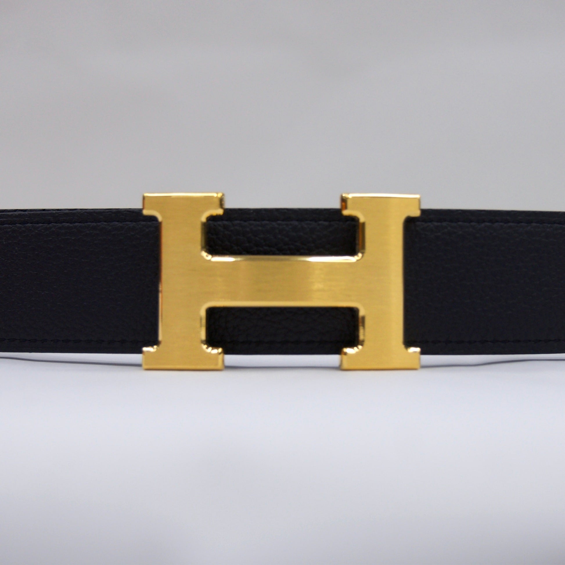 HERMES Cintura blu notte reversibile marrone con fibbia H oro satinato