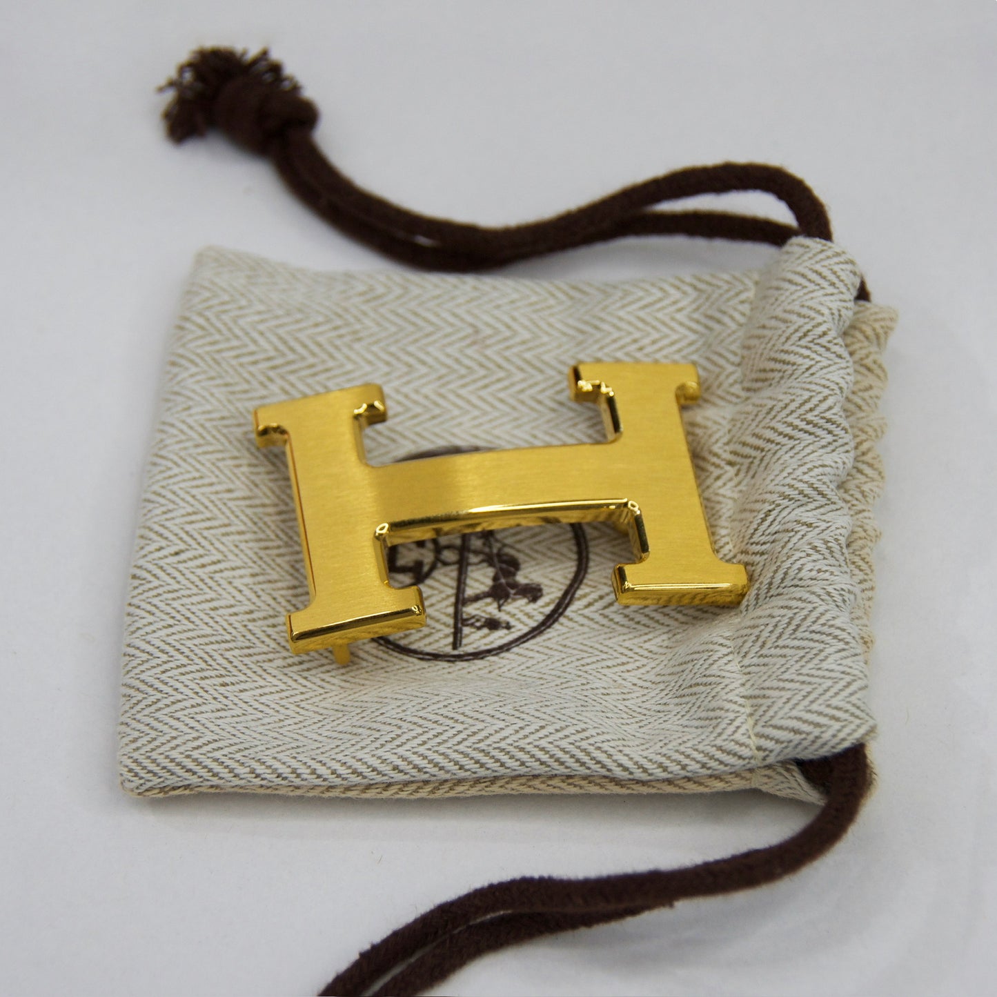 HERMES Cintura blu notte reversibile marrone con fibbia H oro satinato