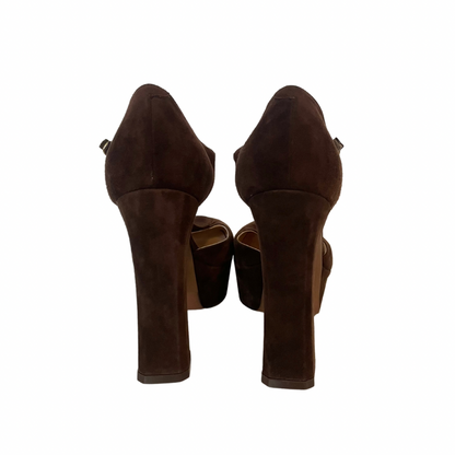 Scarpa decolletè scamosciata marrone testa di moro con tacco alto e grosso, con plateaux e cinturino alla caviglia   Altezza tacco: 11.5 cm  Plateaux: 3.5 cm