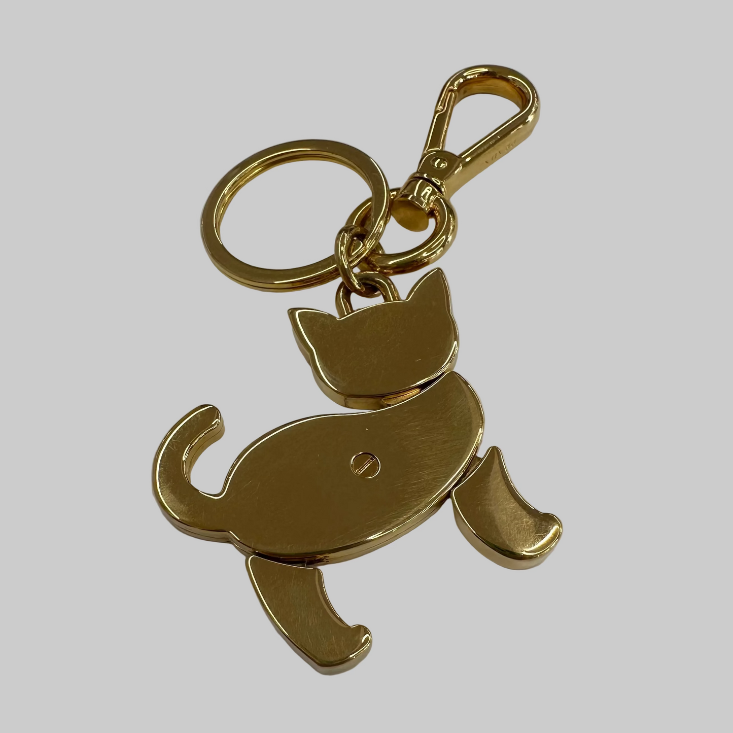 PRADA Ciondolo charms portachiavi dorato con gatto rosso