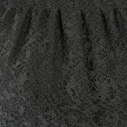 SAINT LAURENT Abito nero in pizzo con borchie