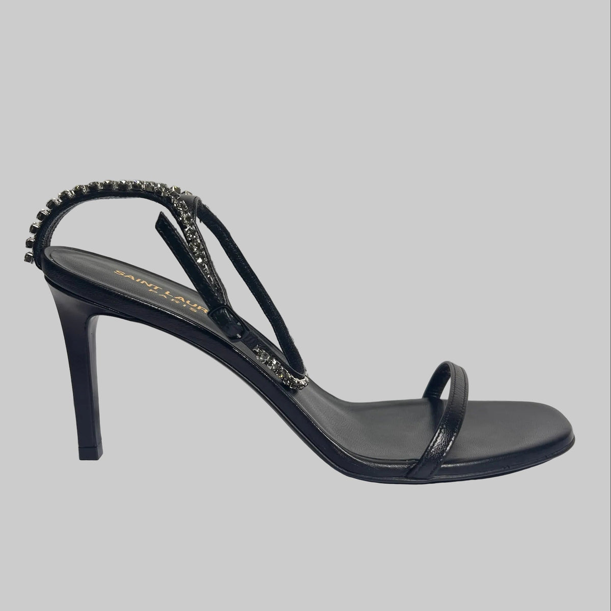 SAINT LAURENT Scarpa sandalo in pelle nera con cinturino caviglia in cristalli