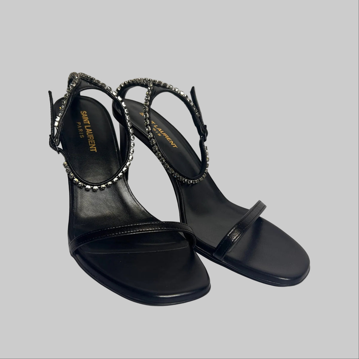 SAINT LAURENT Scarpa sandalo in pelle nera con cinturino caviglia in cristalli