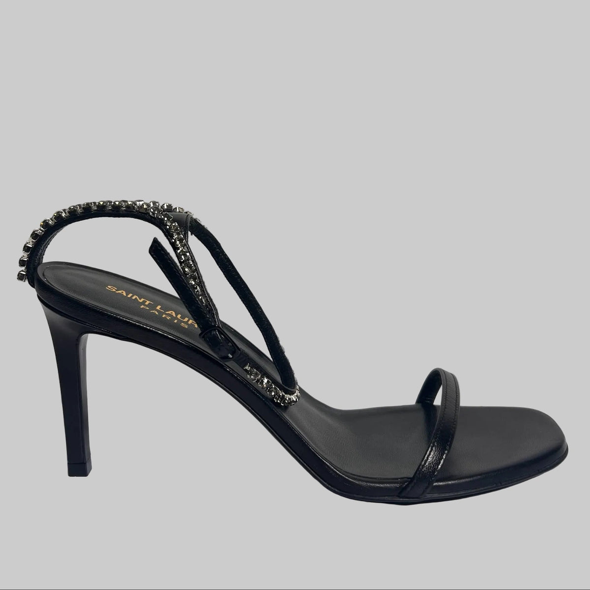 SAINT LAURENT Scarpa sandalo in pelle nera con cinturino caviglia in cristalli